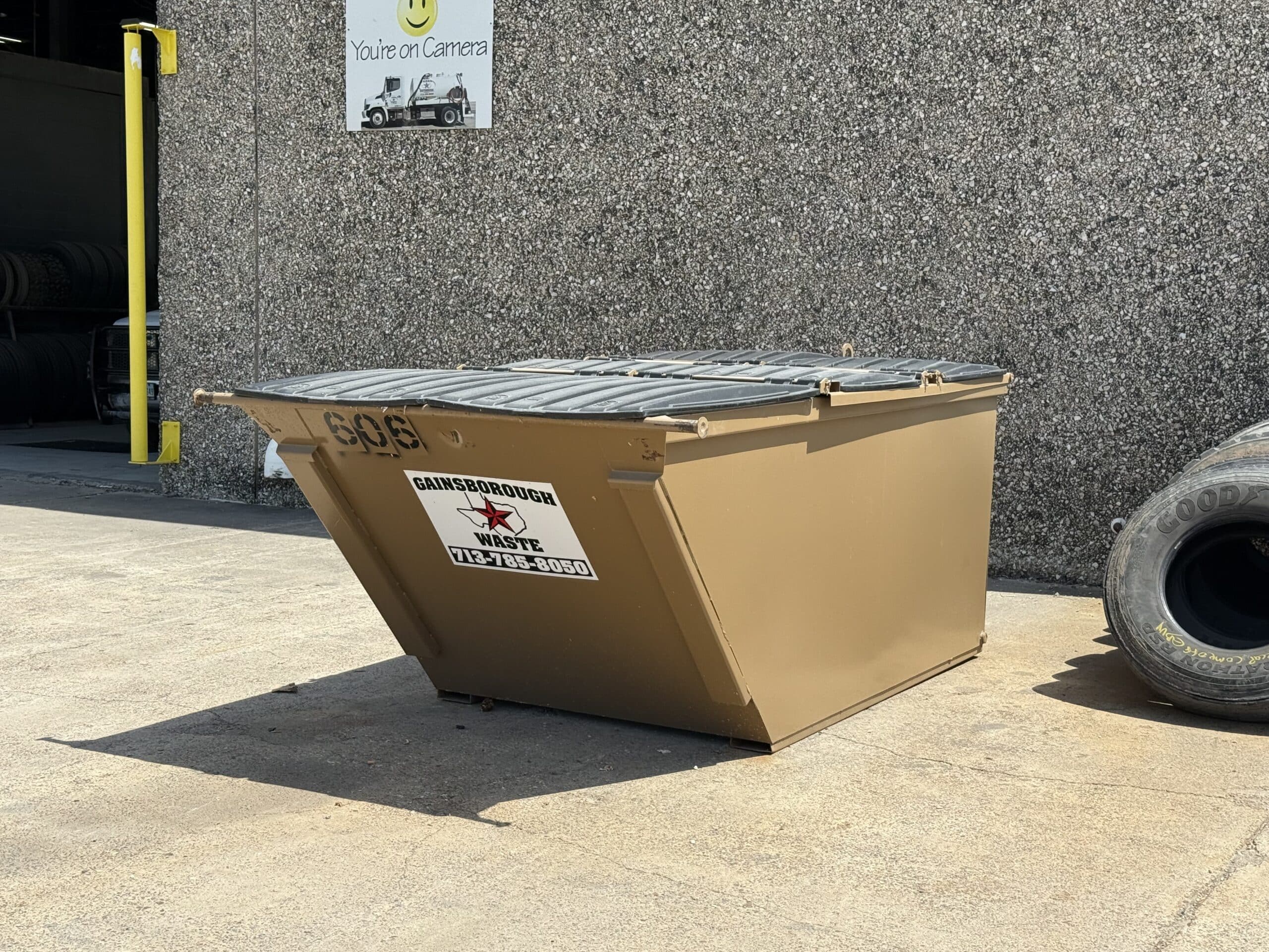 Waste ready to be picked up outside of an office building.